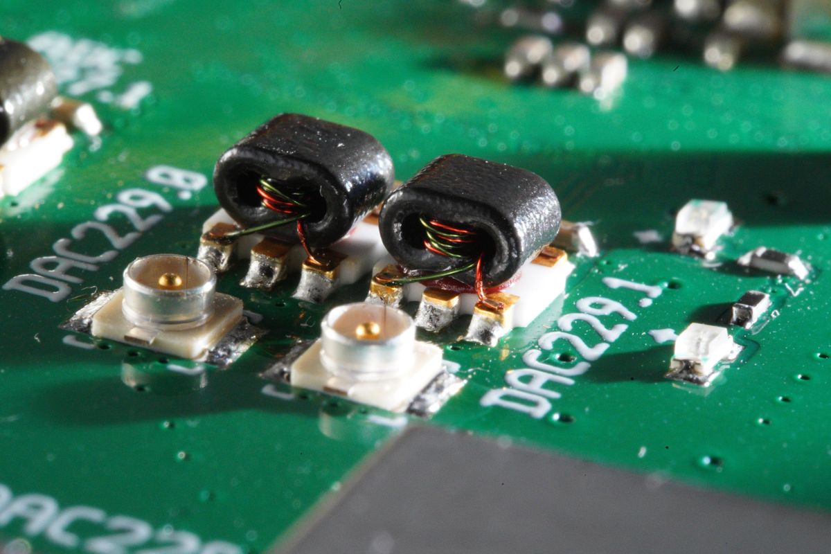 Wire-wound transformers beside RF connectors on a DAC board